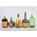 A group of five bottles of assorted alcohol.