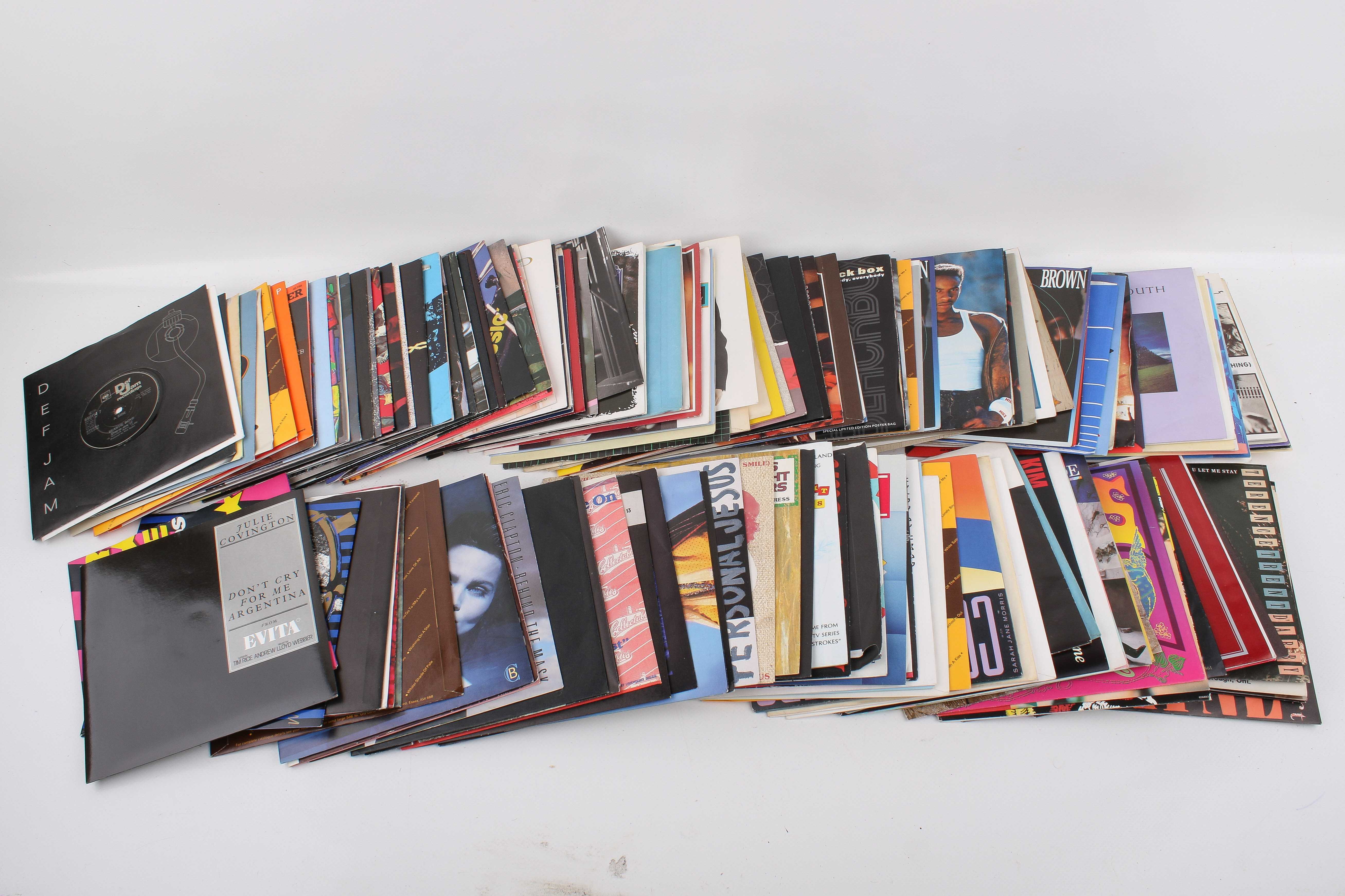 Two boxes of assorted seven inch vinyl single records mostly 1980s.
