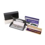 A collection of three boxed pens, A green Waterman Paris fountain pen,