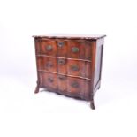 A 19th century oak Dutch Baroque style serpentine commode. Having three drawers.