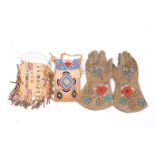 A pair of Native Canadian beaded gloves and two bags.