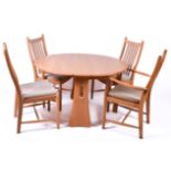 Ercol Windsor gateleg dining table and four chairs.