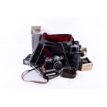 A vintage Praktica SLR film camera S/n 123274 and accessories. With a Carl Zeiss Jena Tessar 2.