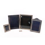 Four silver mounted picture frames and a pair of cufflinks.