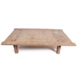An Indonesian limewashed teak weavers table converted to a coffee table.