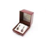 A pair of pear shaped drop earrings set with amethyst and seed pearls. Post and butterfly fittings.
