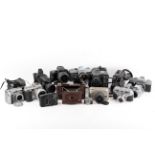 A mixed collection of film, digital, and cine cameras.