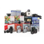 A Collection of mostly Canon and Olympus cameras. All used with makers boxes.