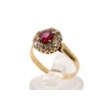 A ruby and diamond cluster ring. Set centrally with a square cushion cut ruby of 0.