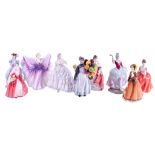 A collection of nine assorted porcelain lady figures and a Spode Coventry Catheldral plate.