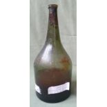 An 18thC glass bottle with contents - found on a wreck off Hastings, 9.75" high.