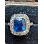 An early 20thC certified natural sapphire & diamond rectangular cluster ring, the cushion cut