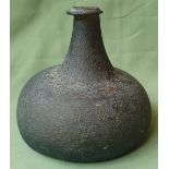 An 18thC glass onion shaped bottle, 5.5" high.