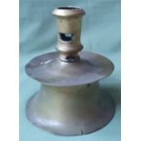 A 17thC brass candlestick with capstan base, 5.5" high.