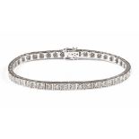 An 18 ct white gold tennis bracelet, set with natural diamonds weighing 4.02 carats.  Length 17.5