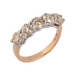An 18 ct two tone gold five stone half eternity ring, set with natural diamonds weighing 2.02