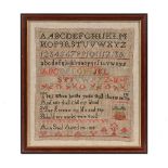 A Georgian needlework by Ann Saul aged 14 dated 1815, with rows of alphabet and numbers, together