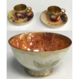 A Royal Worcester coffee can and saucer decorated with grapes and peaches and blackberries on a