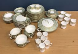 A Royal Doulton Embassy part dinner service comprising 7 twin handled cups and 10 saucers,