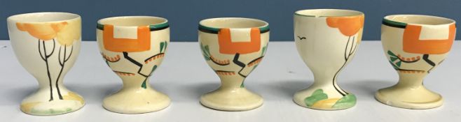 Two Clarice Cliff "Bizarre" geometric design hand-painted egg cups by Wilkinson Ltd,