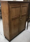 A Victorian pine cupboard,