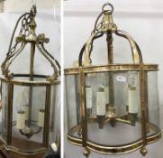 A Georgian style five light brass and glass electrolier, 48 cm long,