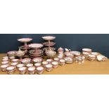 A late Victorian pink banded gilt highlighted and floral spray painted composite tea set comprising