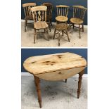 A modern pine oval drop leaf kitchen table in the Victorian style,