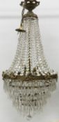 A cut glass ceiling light with brass mounts and ribbon tie decoration, approx.