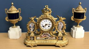 A 19th Century French gitl metal cased clock garniture,