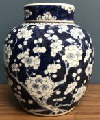 A 19th Century Chinese blue and white prunus blossom decorated ginger jar and cover,
