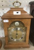 A 20th Century walnut cased mantel clock,