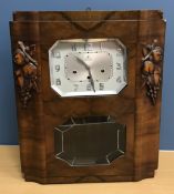 A French walnut cased Art Deco style wall clock with fruit decorated side panels,