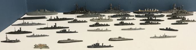 A collection of thirty-four early to mid 20th Century cast lead and other metal flat bottomed naval