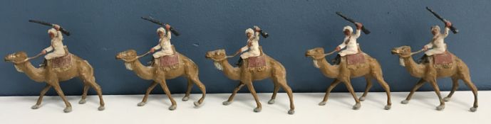 A set of five painted metal model soldiers 