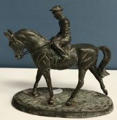 A modern patinated bronze figure of a 