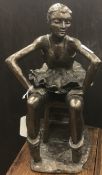 A Frith Products cold cast bronze figure of a seated ballerina after the original design sculpted