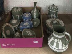 A collection of eleven items of Wedgwood green Jasper ware including jug, onion-shaped vase,