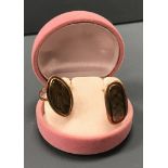 A George III yellow metal mourning ring set with navette form panel of hair,