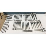 A set of stainless steel cutlery designed by Arne Jacobsen for Anton Michelsen (later Georg Jensen),