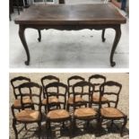 A 20th Century French oak extending dining table in the Louis XV taste,
