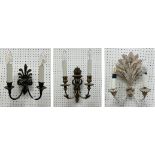 A set of three gilt decorated two branch wall lights with serpent decoration,