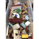 A box containing assorted mid 20th Century doll's house furniture to include dresser, beds,