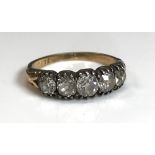 A yellow metal mounted five stone diamond ring, 2.