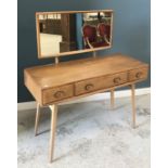 An Ercol elm dressing chest with mirror back over three drawers on splayed supports,