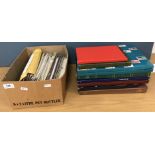A collection of nine stamp albums containing various World stamps and a box containing various