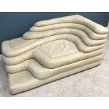 A cream leather upholstered De Sede DS 1025 Terrazza corner sofa of organic form designed by Ubald