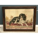 A late Victorian gros point needlework study of a "Spaniel on cushion",