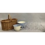 A wicker basket, two Mason Cash pottery measuring jugs in pale blue and cream, six cut glass