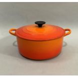 A Le Creuset two handled casserole pan with lid, 24.5cm diameter x 10.5cm high